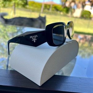 Authentic black Prada sunglasses, wore them once.Perfect condition no scratches